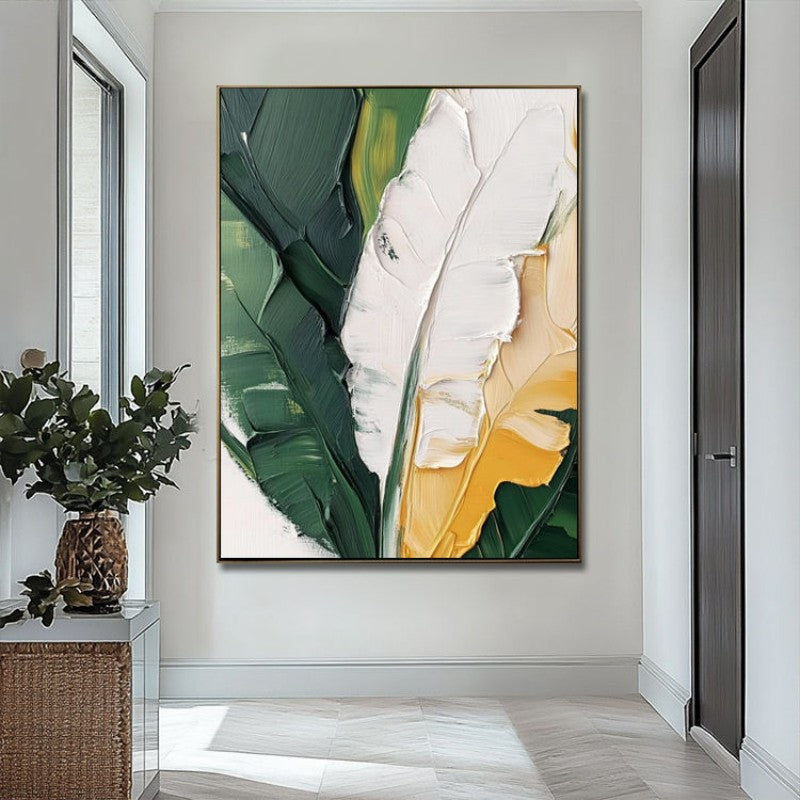 Framed abstract artwork of leaves in a modern interior setting